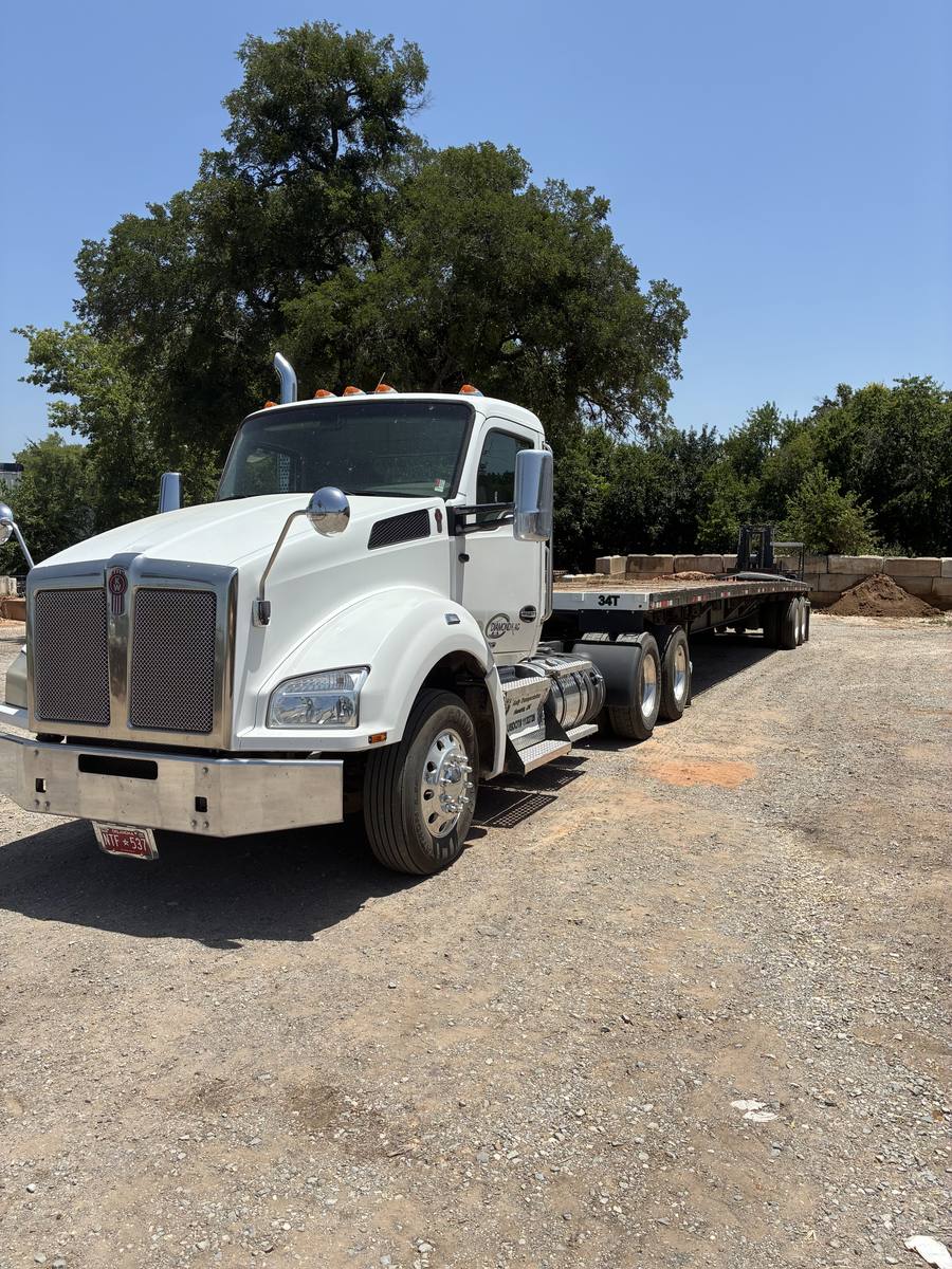 Kelly Sod flatbed truck and forklift in the store yard